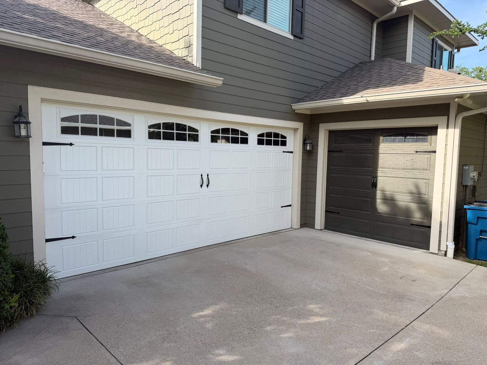 White carriage-style double garage door installed